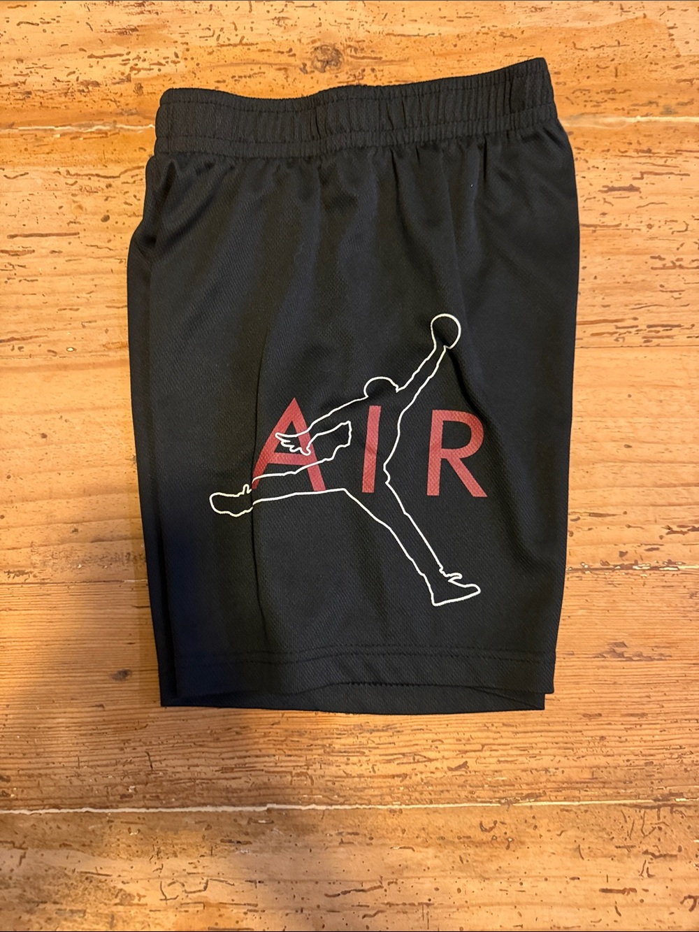 Kids Medium Jordan Black Athletic Shorts with Red AIR Logo